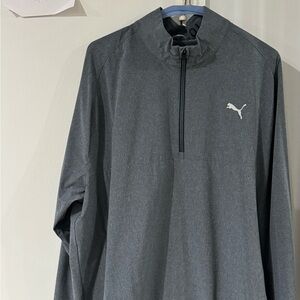 Puma golf quarter zip lightweight jacket with kangaroo pouch.